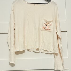 By Anthropologie Daily Practice Ivory “Keep Exploring” Off-Shoulder Crop Sweater